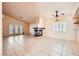 Living room features tile floors, fireplace, ceiling fan and natural light at 1424 Desert Hills Dr, Las Vegas, NV 89117