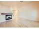 Bright and airy living room featuring tiled flooring, a modern fireplace, and ample space, ready for personalization at 1424 Desert Hills Dr, Las Vegas, NV 89117