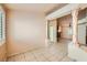 Bright living area with tile floors, marble columns, and a view into other rooms of the house at 1424 Desert Hills Dr, Las Vegas, NV 89117