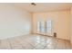 Bright living room with tile flooring and doors to the outside at 1424 Desert Hills Dr, Las Vegas, NV 89117