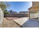 Enclosed backyard with a concrete patio and rock landscaping offers low maintenance outdoor living at 1444 Country Hollow Dr, Las Vegas, NV 89117