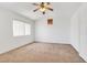 Bedroom featuring neutral carpet, a ceiling fan, and a vaulted ceiling at 1444 Country Hollow Dr, Las Vegas, NV 89117