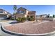 Two-story home showcasing a desert landscaped front yard and a two-car garage at 1444 Country Hollow Dr, Las Vegas, NV 89117