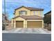 Two story home featuring a two car garage, neutral paint, and desert landscaping at 180 Plumpjack Ave, Henderson, NV 89002