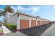 Multiple garages with pink doors and a neatly paved driveway at 1800 Edmond St # 108, Las Vegas, NV 89146