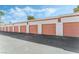 Several garages with brick accents and pink doors at 1800 Edmond St # 108, Las Vegas, NV 89146