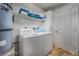 Laundry room includes a washer, dryer, and above shelf at 1800 Edmond St # 108, Las Vegas, NV 89146