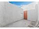 Enclosed patio with a bench and a textured white wall at 1800 Edmond St # 108, Las Vegas, NV 89146