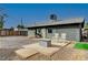 Backyard view of house, patio, and rocking chairs at 207 W Victory Rd, Henderson, NV 89015