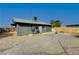 Backyard with gravel and view of house exterior at 207 W Victory Rd, Henderson, NV 89015