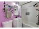 Updated bathroom with white vanity, subway tile, and a shower/tub combo at 207 W Victory Rd, Henderson, NV 89015