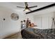 Serene bedroom with ceiling fan, moon wall art, and double closet at 207 W Victory Rd, Henderson, NV 89015