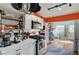 Modern kitchen with white cabinets and orange accent wall at 207 W Victory Rd, Henderson, NV 89015