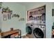 Clean laundry room with stacked LG washer and dryer at 207 W Victory Rd, Henderson, NV 89015