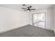 This carpeted bedroom features a ceiling fan and an open door to the room next door at 2133 Linden Tree St, Las Vegas, NV 89156