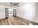 Bright and airy bedroom featuring sleek flooring, a modern ceiling fan, and an open doorway at 2133 Linden Tree St, Las Vegas, NV 89156