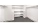 Walk in closet with built-in shelving and carpeting at 2133 Linden Tree St, Las Vegas, NV 89156