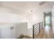 Upstairs hallway with modern railing, wood floors, and built in cabinets at 2133 Linden Tree St, Las Vegas, NV 89156