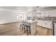 This kitchen features laminate floors, an island, and modern appliances at 2133 Linden Tree St, Las Vegas, NV 89156