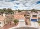 Aerial view of the home showcasing a well-maintained landscape and a two-car garage at 2153 Hookcross Cir, Henderson, NV 89074