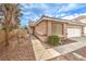 Inviting front entrance with a walkway, desert landscaping, and a two-car garage at 2153 Hookcross Cir, Henderson, NV 89074