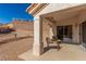 Covered back patio with seating, offering a comfortable outdoor living space at 2401 Rockford St, Las Vegas, NV 89134