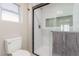 Modern bathroom featuring a walk-in shower with gray accents, and a tiled nook at 2401 Rockford St, Las Vegas, NV 89134