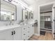 Elegant bathroom featuring double sinks, quartz countertops, and a glass-enclosed shower at 2401 Rockford St, Las Vegas, NV 89134