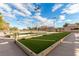 Well-maintained bocce ball court with artificial turf, benches, and lighting for evening games at 2401 Rockford St, Las Vegas, NV 89134