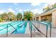 Community pool and pool house area featuring lounge chairs, covered seating, and a spa at 2401 Rockford St, Las Vegas, NV 89134