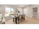 Well-lit dining area featuring contemporary decor and backyard view from a large window at 2401 Rockford St, Las Vegas, NV 89134