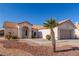 Charming single-story home with a well-maintained desert landscape and tile roof at 2401 Rockford St, Las Vegas, NV 89134