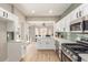 Modern kitchen with stainless steel appliances, white cabinets, and sleek countertops at 2401 Rockford St, Las Vegas, NV 89134