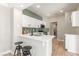 Stylish kitchen featuring white cabinetry, quartz countertops, and stainless steel appliances at 2401 Rockford St, Las Vegas, NV 89134