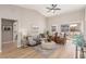 Bright living room featuring vaulted ceilings, stylish furnishings, and sliding glass doors to the backyard at 2401 Rockford St, Las Vegas, NV 89134