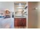 Stylish wet bar area featuring custom cabinets, granite countertops and modern fixtures at 2451 N Rainbow Blvd # 2139, Las Vegas, NV 89108