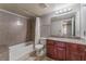 Bathroom with a tub and shower combination and granite countertop vanity at 2451 N Rainbow Blvd # 2139, Las Vegas, NV 89108