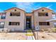 Condo building featuring accessible entrance, covered parking, and lush desert landscaping at 2451 N Rainbow Blvd # 2139, Las Vegas, NV 89108