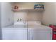 Laundry area with side by side washer and dryer with storage shelf above at 2451 N Rainbow Blvd # 2139, Las Vegas, NV 89108