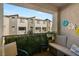 Balcony view of building facade featuring outdoor seating and privacy greenery, perfect for relaxation at 2844 Copper Wind Ln # 4, Las Vegas, NV 89183