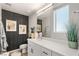 This bathroom offers a clean aesthetic with framed artwork and sleek fixtures and hardware at 2844 Copper Wind Ln # 4, Las Vegas, NV 89183