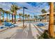 Relaxing community pool with lounge chairs, picnic tables, and covered seating at 2844 Copper Wind Ln # 4, Las Vegas, NV 89183