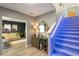 Entry foyer featuring stylish decor and illuminated stairs leading upstairs at 2844 Copper Wind Ln # 4, Las Vegas, NV 89183