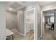 Hallway view features easy access to a well-lit laundry room, creating a functional and accessible layout at 2844 Copper Wind Ln # 4, Las Vegas, NV 89183