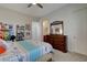 Bright bedroom featuring a ceiling fan, stylish dresser, and a convenient ensuite bathroom access at 3 Chenal Pass, Henderson, NV 89052