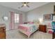 Sunlit bedroom with a cozy bed, pink curtains, soft carpet, and comfortable, stylish furnishings at 3 Chenal Pass, Henderson, NV 89052