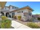 A covered walkway leads to the front door, accentuated by beautiful landscaping and architectural details at 3 Chenal Pass, Henderson, NV 89052