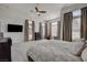 Spacious main bedroom featuring a ceiling fan, plush carpet, and natural light from several large windows at 3 Chenal Pass, Henderson, NV 89052