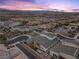 Aerial view of the home and neighborhood showcasing the beautiful mountain views at 3025 Merlesco Ave, Henderson, NV 89044