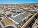 Stunning aerial view of a modern home with an outdoor lounge area, manicured landscaping, and in a vibrant community at 3025 Merlesco Ave, Henderson, NV 89044